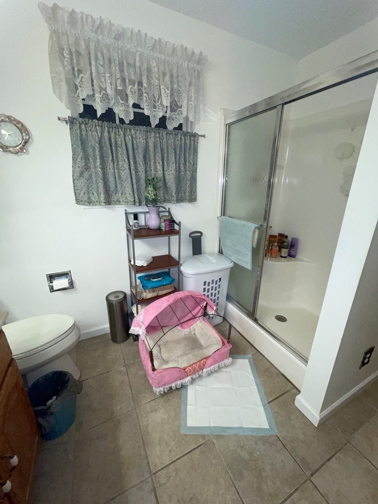 204 Crystal Springs Road Cleveland, TN 37323 - Photo 12 of 22 a bedroom with a bed and a chair