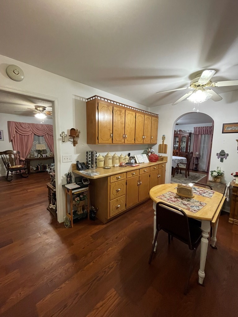 204 Crystal Springs Road Cleveland, TN 37323 - Photo 4 of 22 a kitchen with a table chairs refrigerator and cabinets