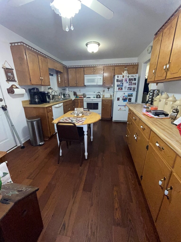 204 Crystal Springs Road Cleveland, TN 37323 - Photo 5 of 22 a living room with stainless steel appliances a dining table wooden floor and a view of kitchen