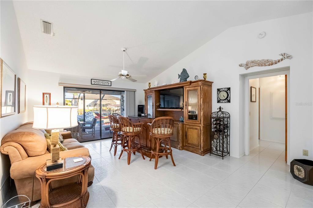 10534 Alpaca Circle Port Charlotte, FL 33981 - Photo 12 of 67 a living room with furniture a window and a flat screen tv