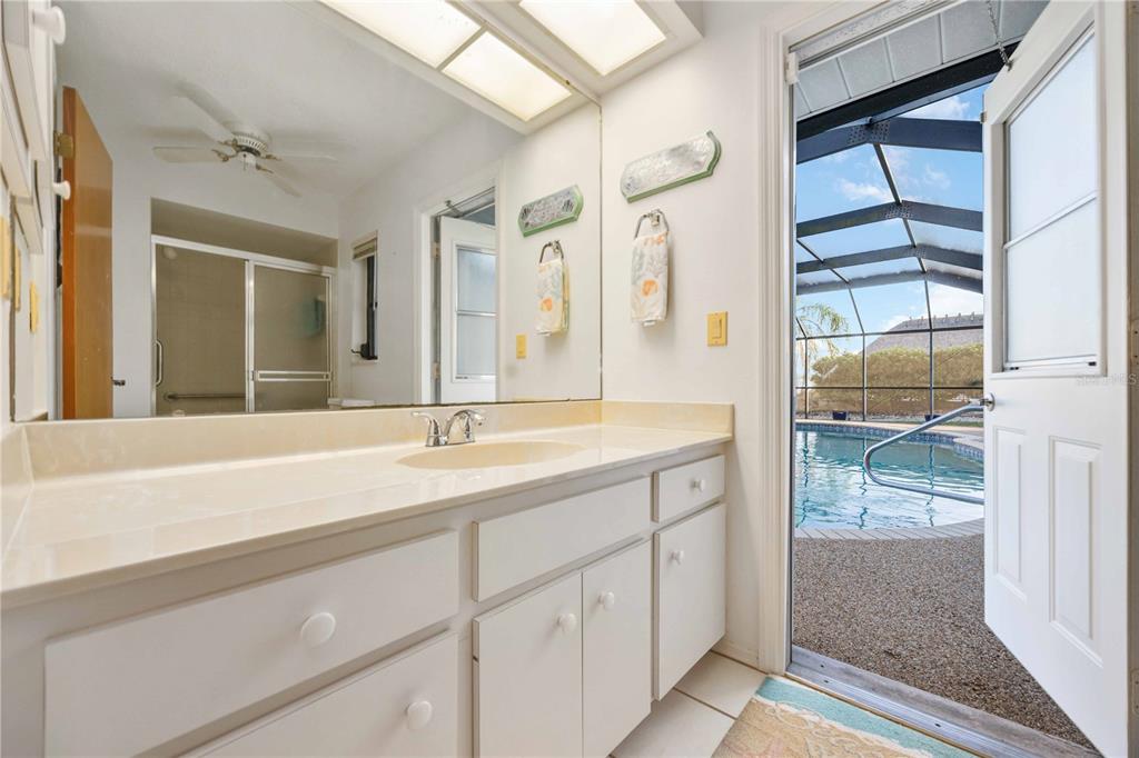 10534 Alpaca Circle Port Charlotte, FL 33981 - Photo 25 of 67 a bathroom with a shower sink and mirror