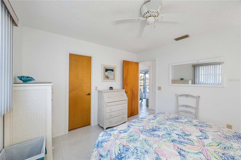 10534 Alpaca Circle Port Charlotte, FL 33981 - Photo 26 of 67 a bedroom with a bed and a cabinets