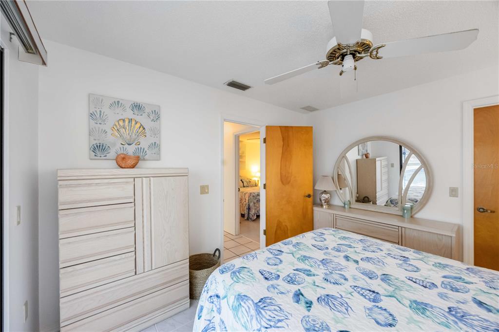 10534 Alpaca Circle Port Charlotte, FL 33981 - Photo 28 of 67 a bedroom with a bed and a dresser