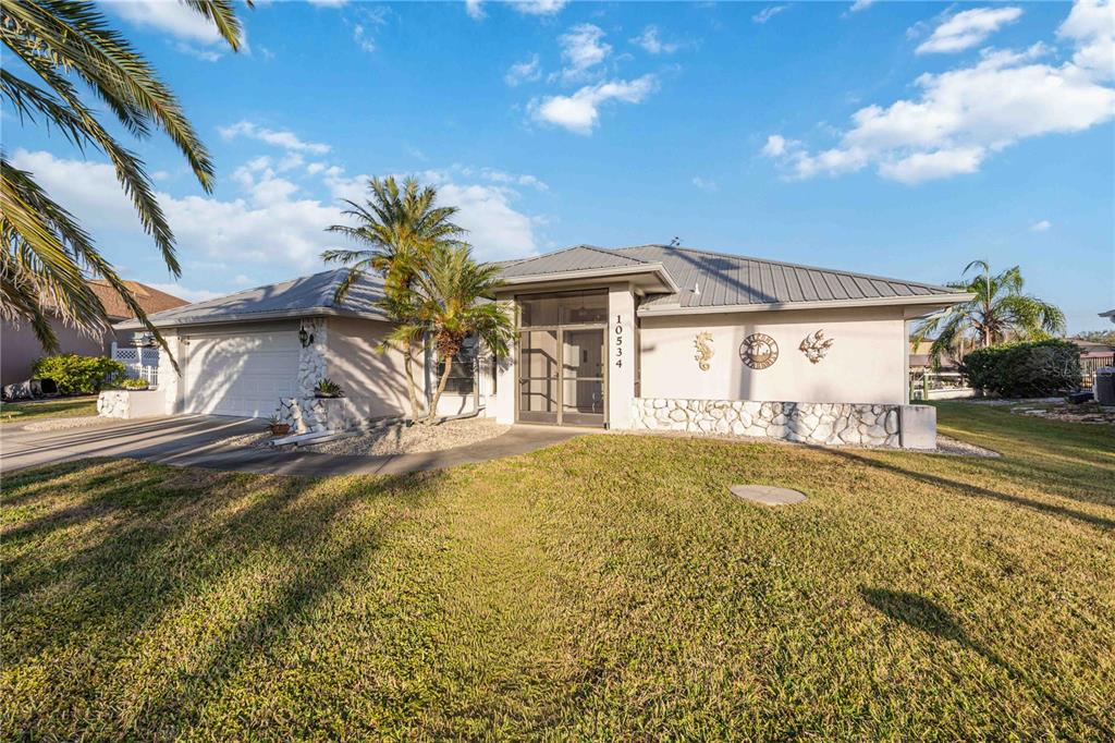 10534 Alpaca Circle Port Charlotte, FL 33981 - Photo 3 of 67 a view of a house with a swimming pool