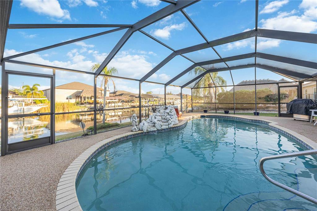 10534 Alpaca Circle Port Charlotte, FL 33981 - Photo 37 of 67 a view of a swimming pool with an outdoor seating