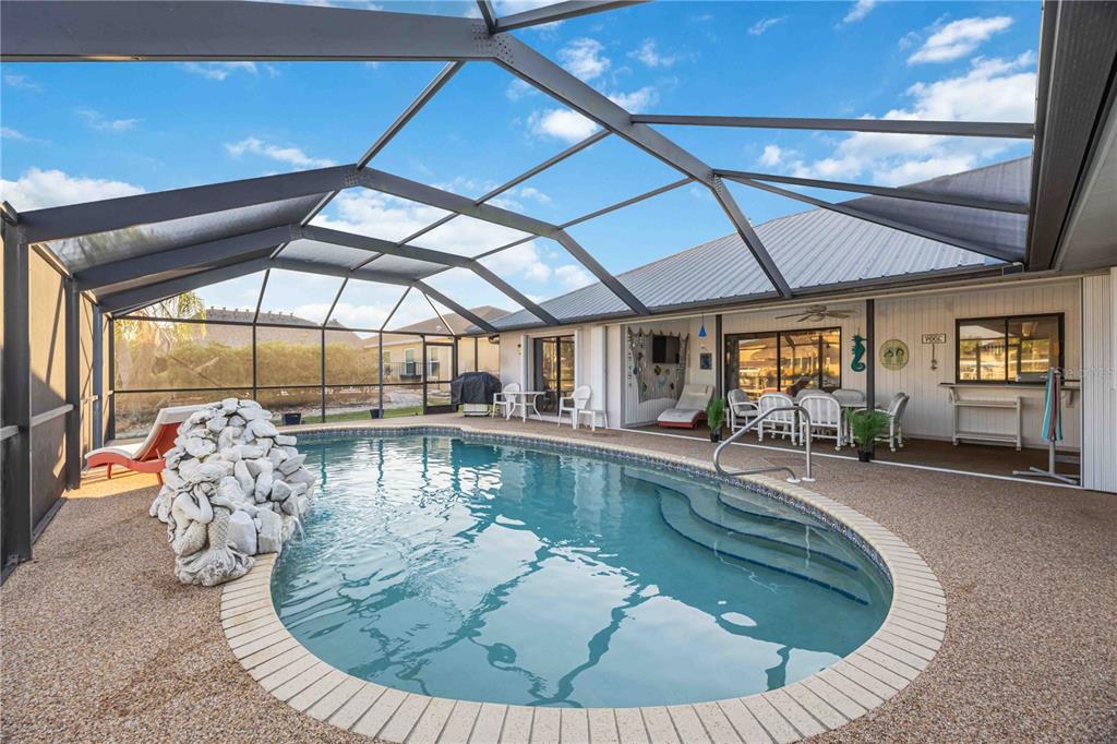 10534 Alpaca Circle Port Charlotte, FL 33981 - Photo 38 of 67 a view of a swimming pool with lounge chair