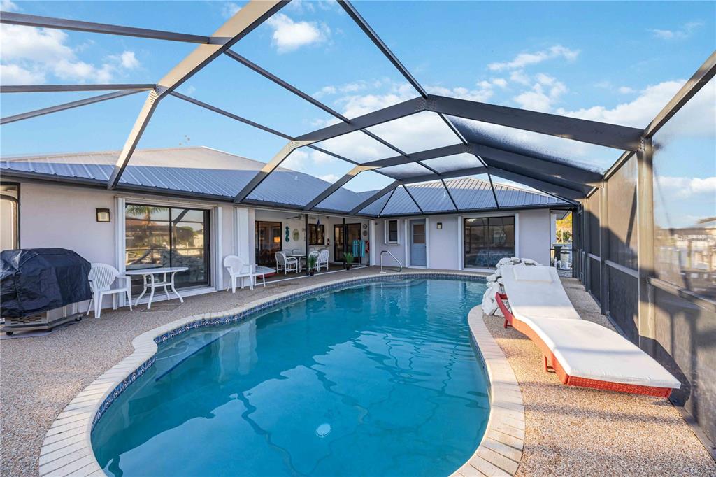 10534 Alpaca Circle Port Charlotte, FL 33981 - Photo 39 of 67 a view of a swimming pool with a patio