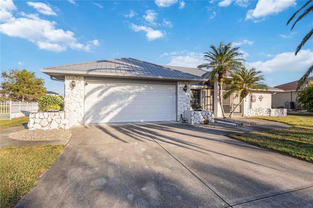 10534 Alpaca Circle Port Charlotte, FL 33981 - Photo 42 of 67 a view of a house with a yard and plants