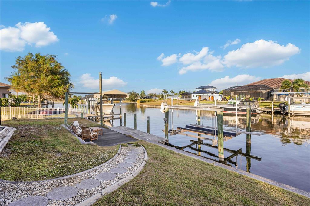 10534 Alpaca Circle Port Charlotte, FL 33981 - Photo 47 of 67 a view of a swimming pool with lawn chairs