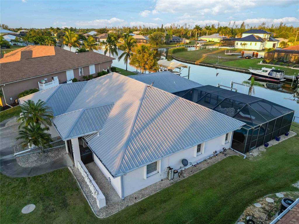 10534 Alpaca Circle Port Charlotte, FL 33981 - Photo 61 of 67 an aerial view of a house with a garden and lake view