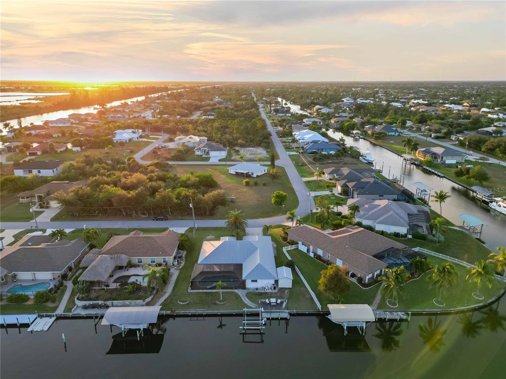 10534 Alpaca Circle Port Charlotte, FL 33981 - Photo 63 of 67 an aerial view of a houses with a lake