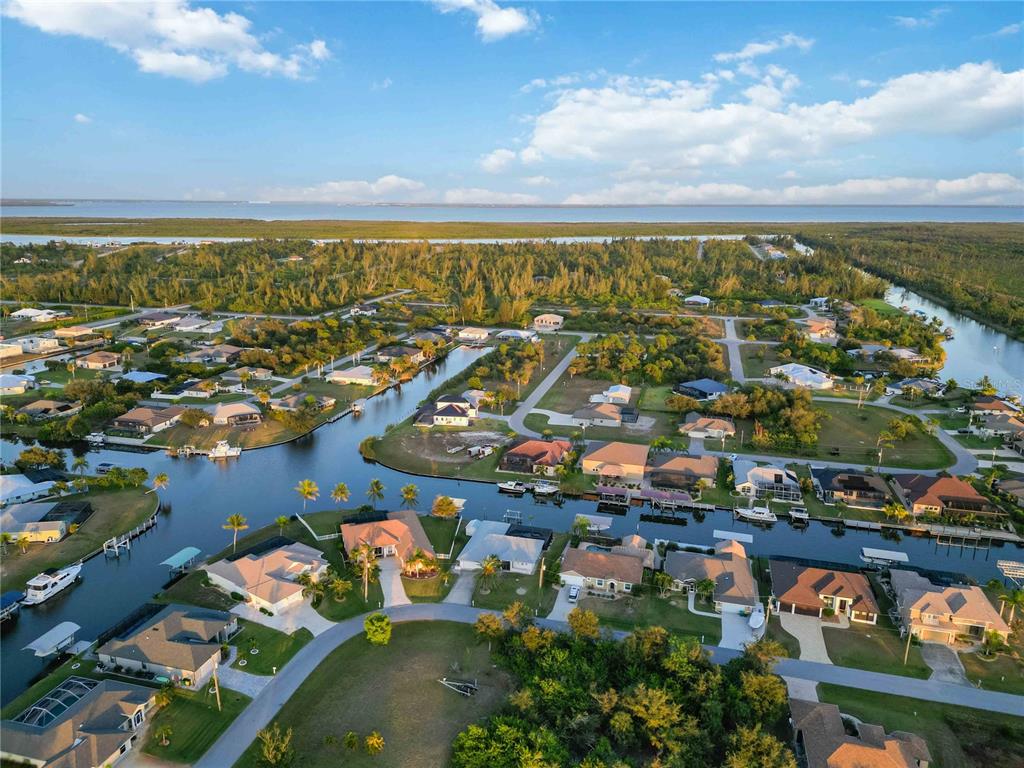10534 Alpaca Circle Port Charlotte, FL 33981 - Photo 67 of 67 an aerial view of a city with lots of residential buildings ocean and mountain view in back