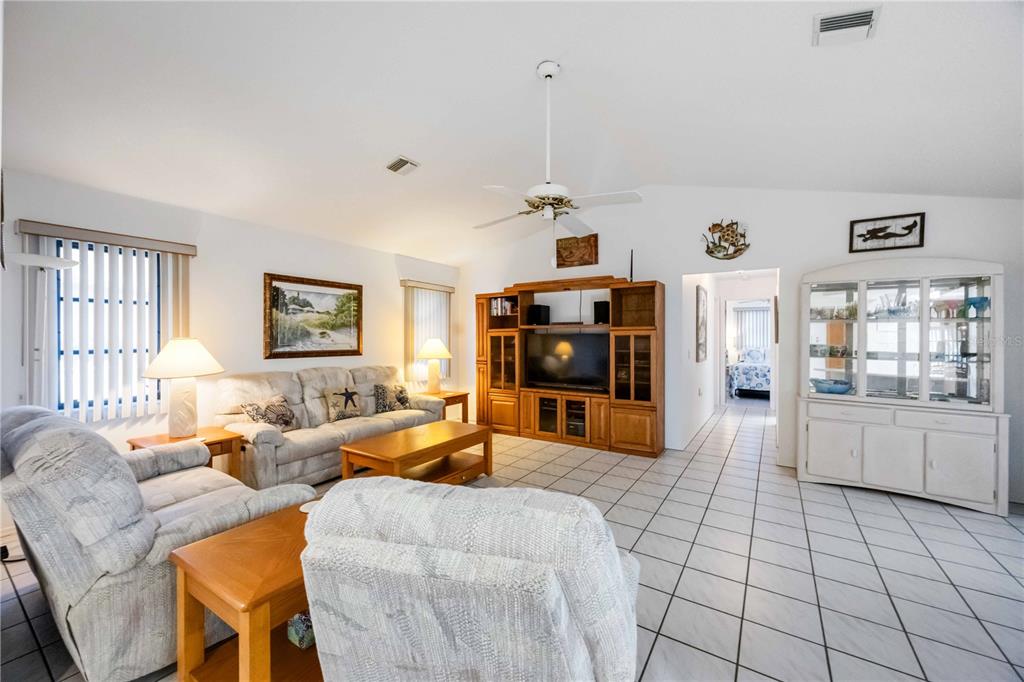 10534 Alpaca Circle Port Charlotte, FL 33981 - Photo 10 of 67 a living room with furniture and wooden floor