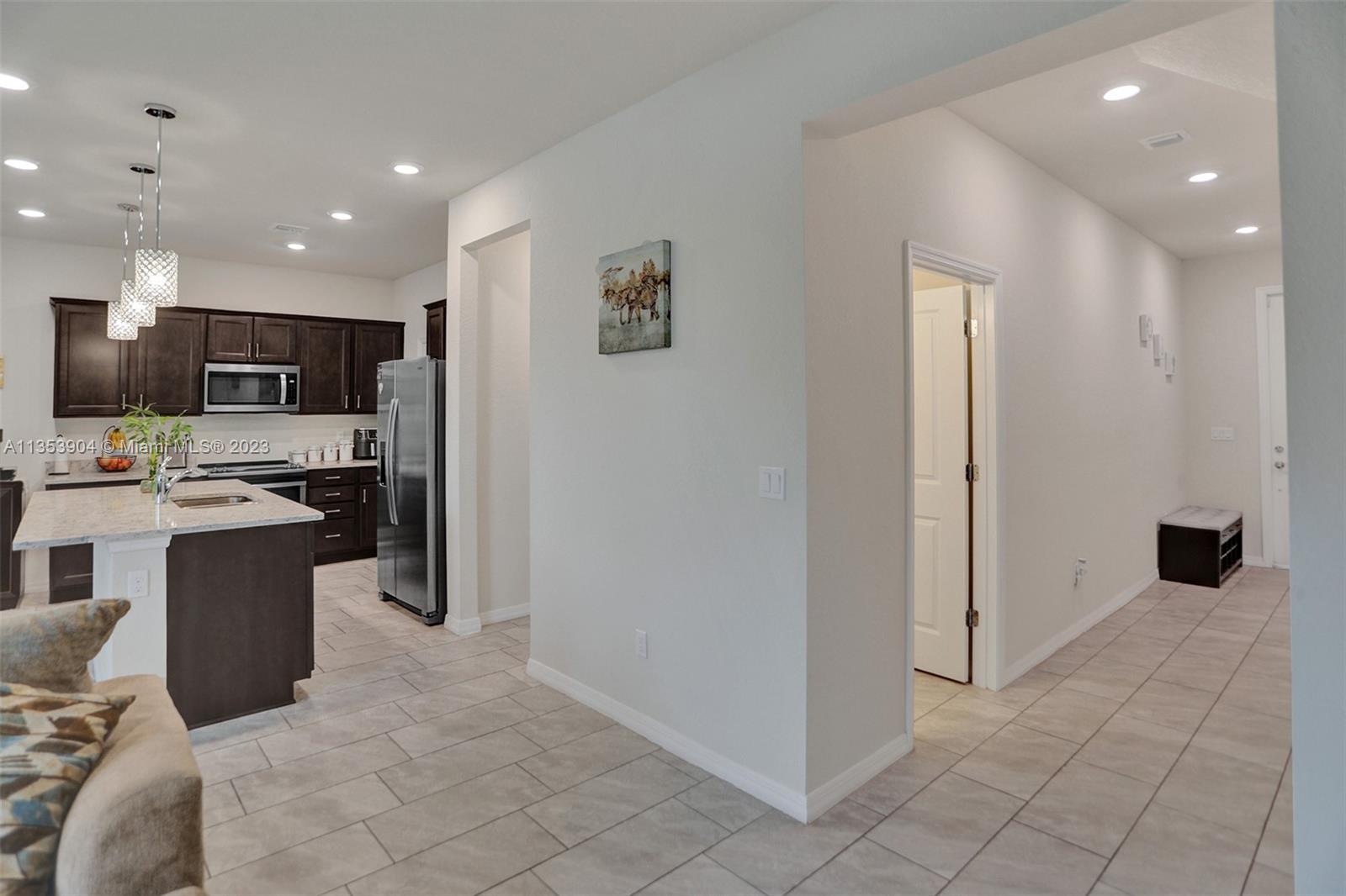4764 Eucalyptus Drive, Unit 4764 Hollywood, FL 33021 - Photo 22 of 54 a kitchen with stainless steel appliances a refrigerator sink and microwave