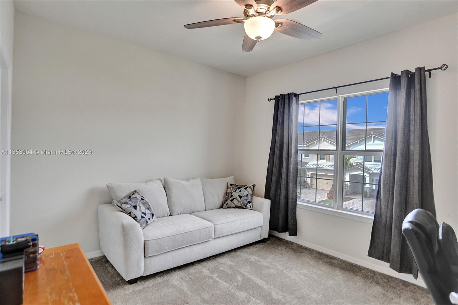 4764 Eucalyptus Drive, Unit 4764 Hollywood, FL 33021 - Photo 29 of 54 a living room with furniture and a window