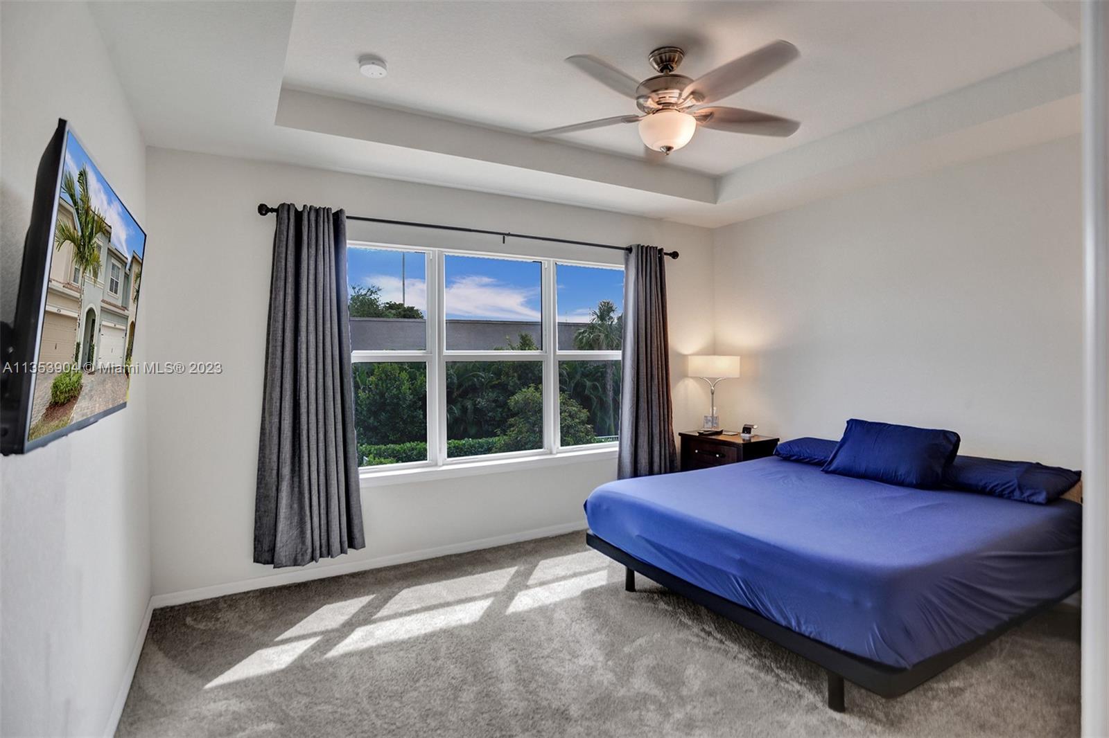 4764 Eucalyptus Drive, Unit 4764 Hollywood, FL 33021 - Photo 37 of 54 a bedroom with a bed and a large window