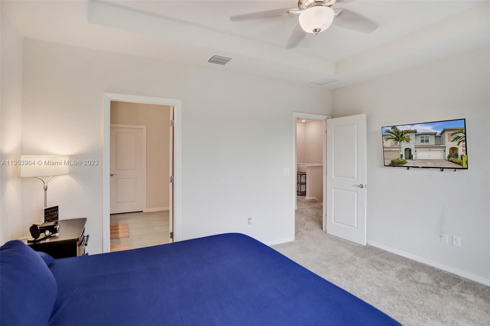 4764 Eucalyptus Drive, Unit 4764 Hollywood, FL 33021 - Photo 39 of 54 a view of a bedroom with a bed and cabinet