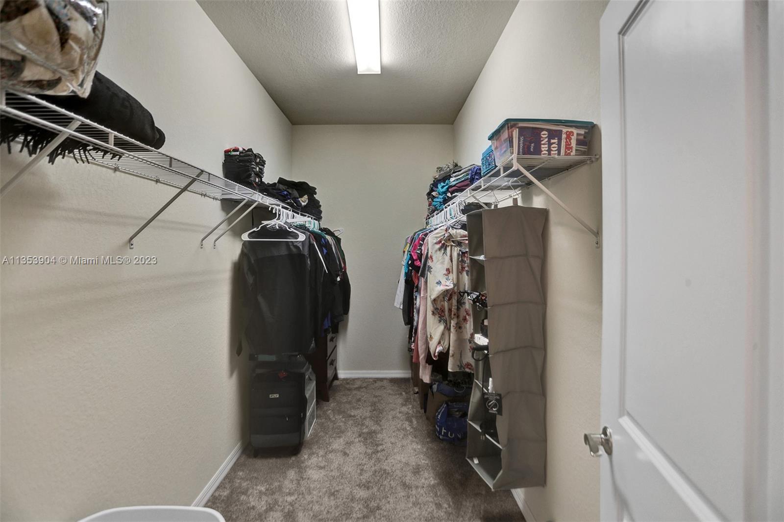 4764 Eucalyptus Drive, Unit 4764 Hollywood, FL 33021 - Photo 42 of 54 a view of walk in closet with clothes and shoes