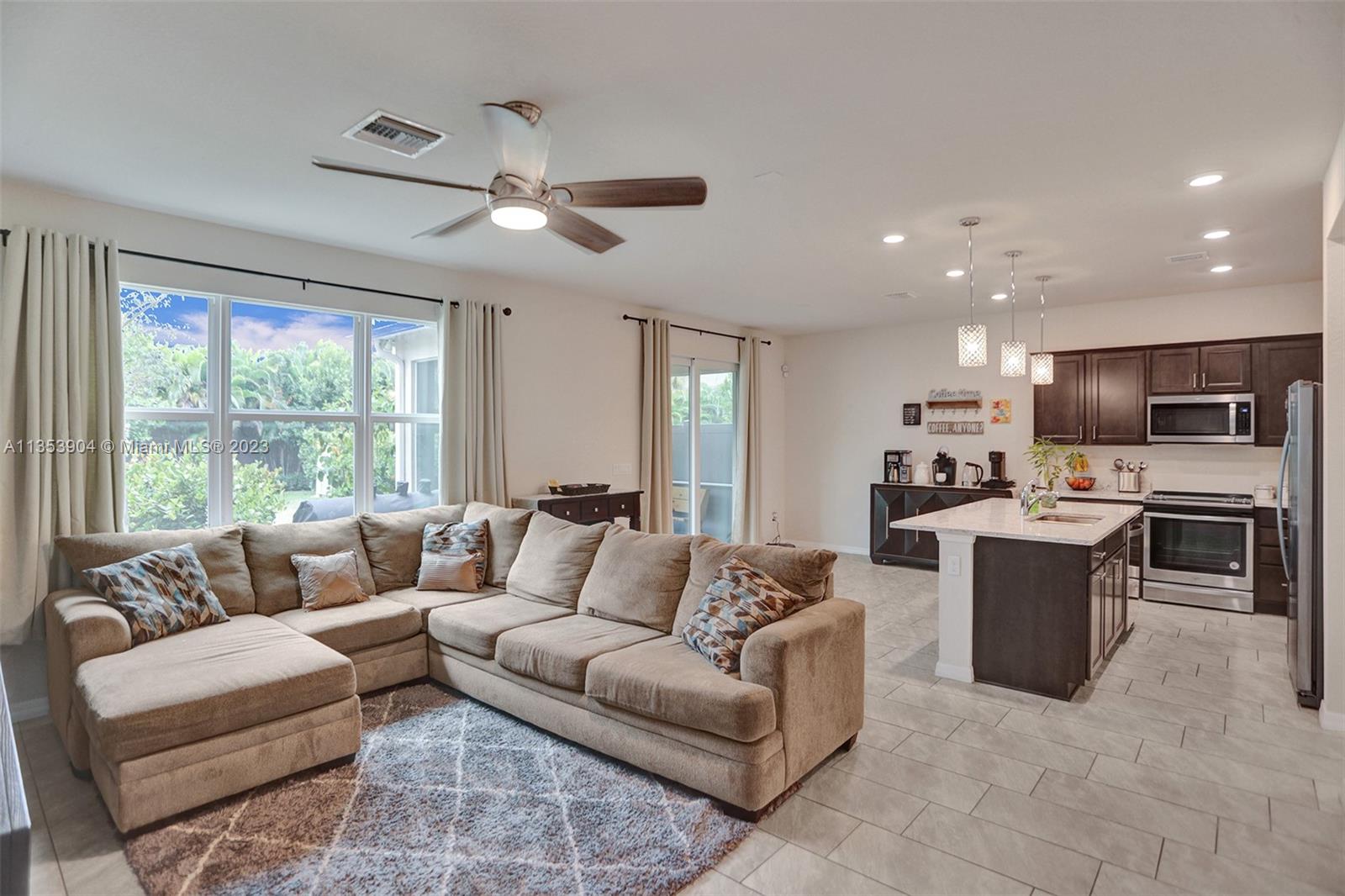 4764 Eucalyptus Drive, Unit 4764 Hollywood, FL 33021 - Photo 5 of 54 a living room with furniture and a large window