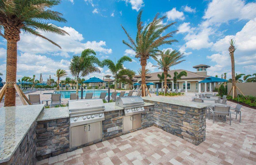 4764 Eucalyptus Drive, Unit 4764 Hollywood, FL 33021 - Photo 51 of 54 a large outdoor space with lots of table and chairs