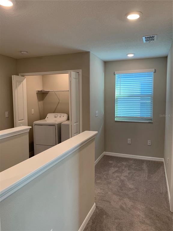 4412 Summer Savory Street Tampa, FL 33619 - Photo 14 of 40 en suite bathroom with a toilet sink and mirror