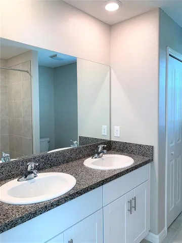 a view of a small space with a window and a fan