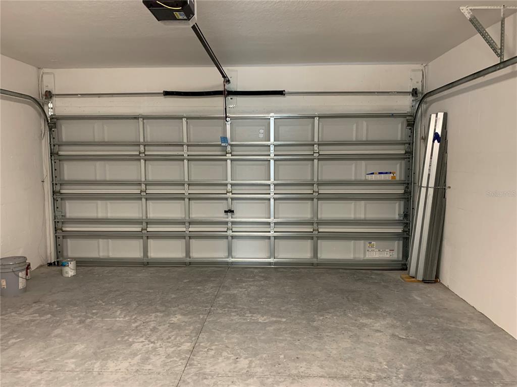 4412 Summer Savory Street Tampa, FL 33619 - Photo 26 of 40 a view of a room with shelves