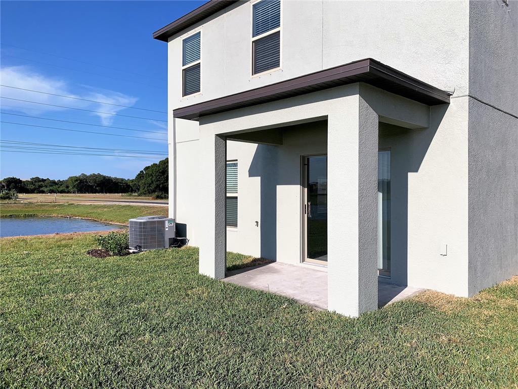 4412 Summer Savory Street Tampa, FL 33619 - Photo 29 of 40 a view of a house with a yard