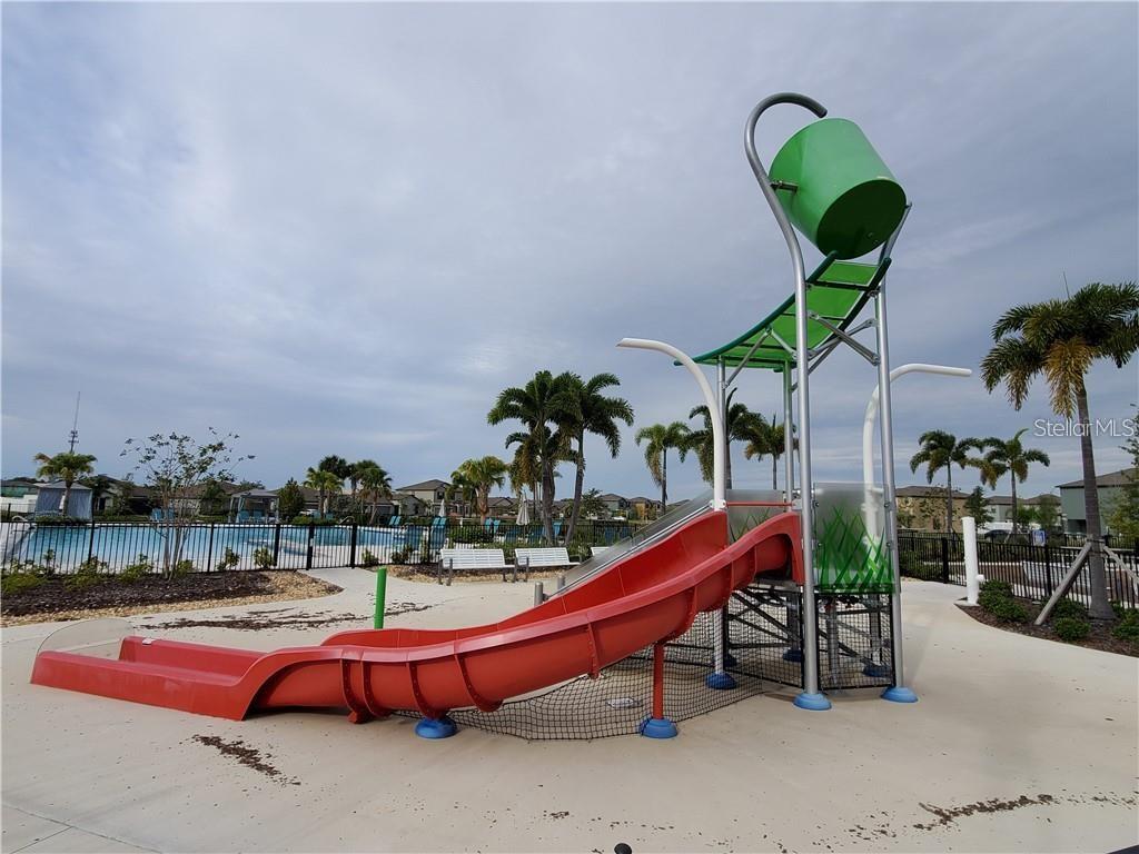 4412 Summer Savory Street Tampa, FL 33619 - Photo 34 of 40 a swimming pool with outdoor seating and city view