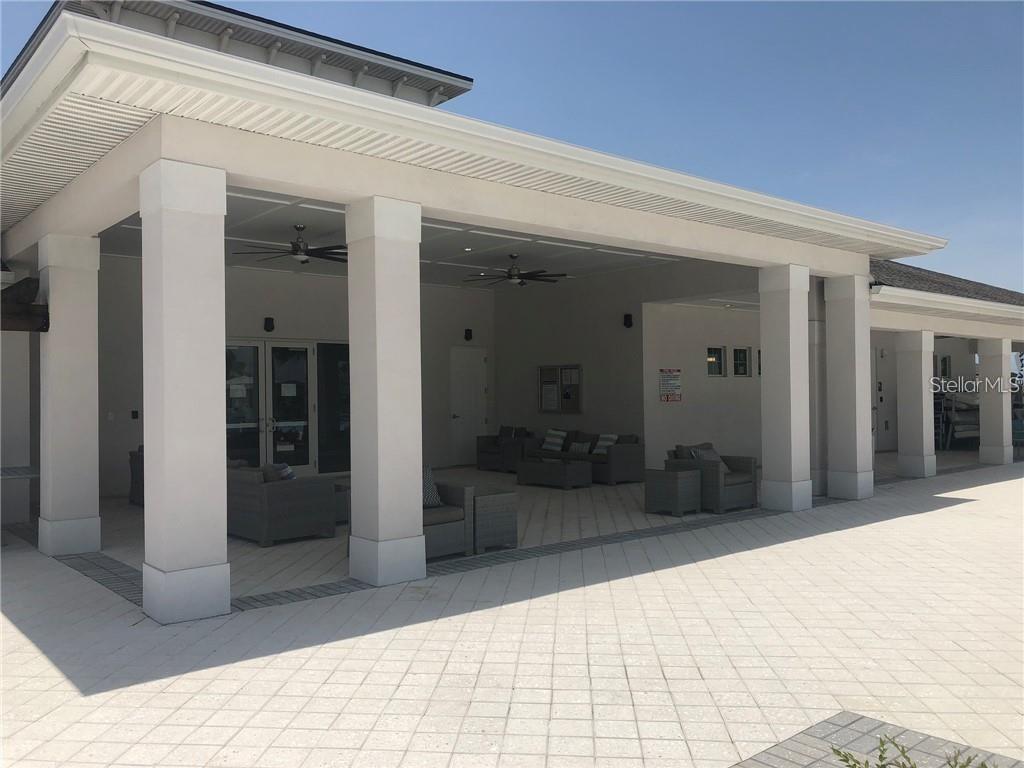 4412 Summer Savory Street Tampa, FL 33619 - Photo 35 of 40 a view of a hallway with wooden floor and livingroom