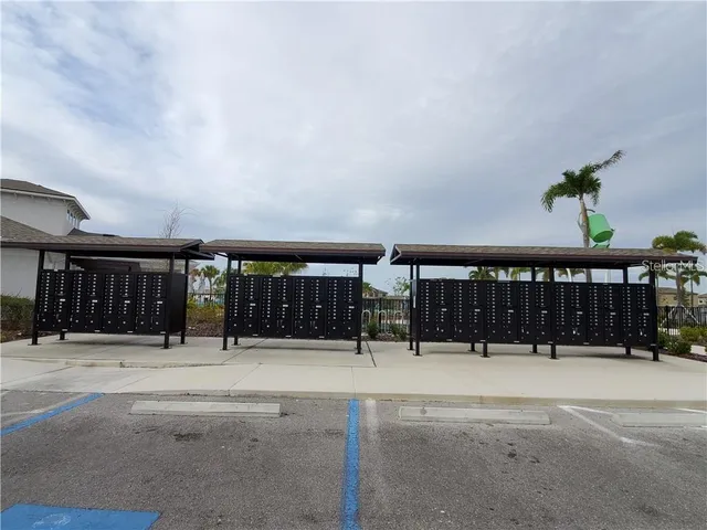 a view of a patio with a dining table and chairs