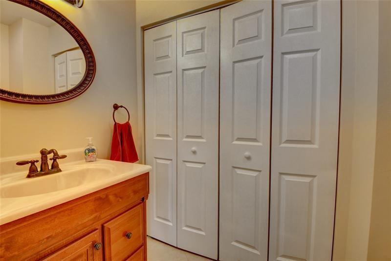 9316 Ketay Circle Boca Raton, FL 33428 - Photo 16 of 30 a bathroom with a sink and a mirror