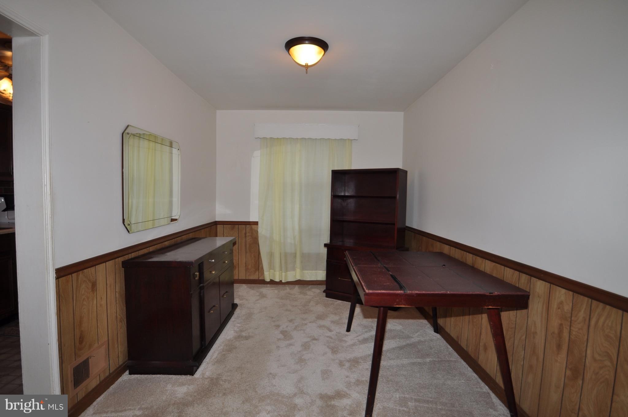 7438 Durwood Road Baltimore, MD 21222 - Photo 5 of 20 a room with furniture and a window