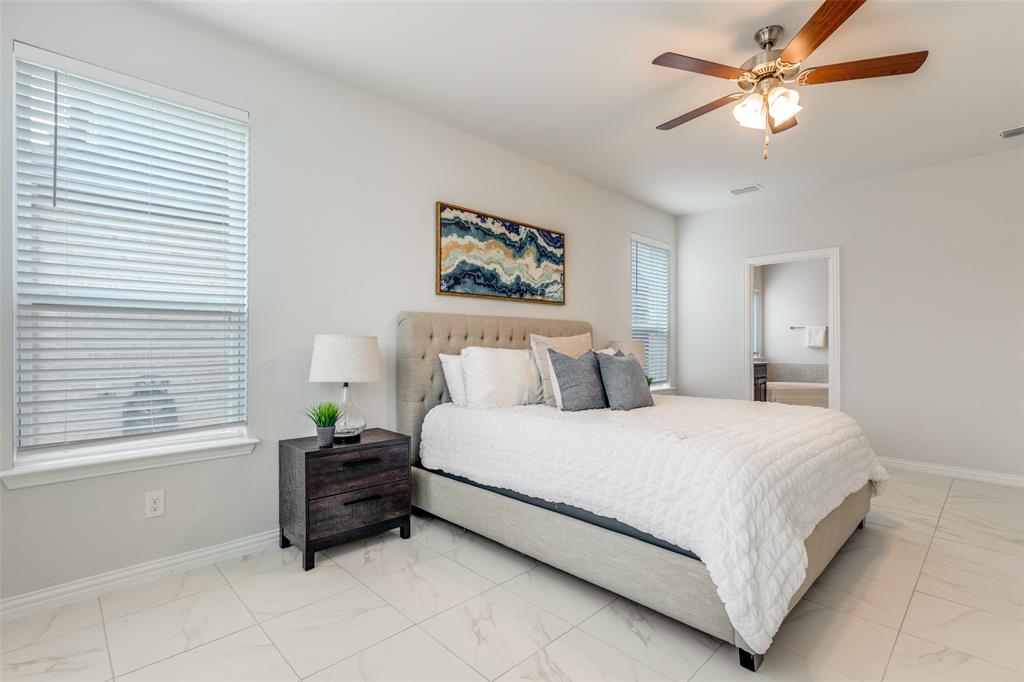 2176 Olive Branch Road Frisco, TX 75033 - Photo 14 of 35 a bedroom with a bed dresser and a window