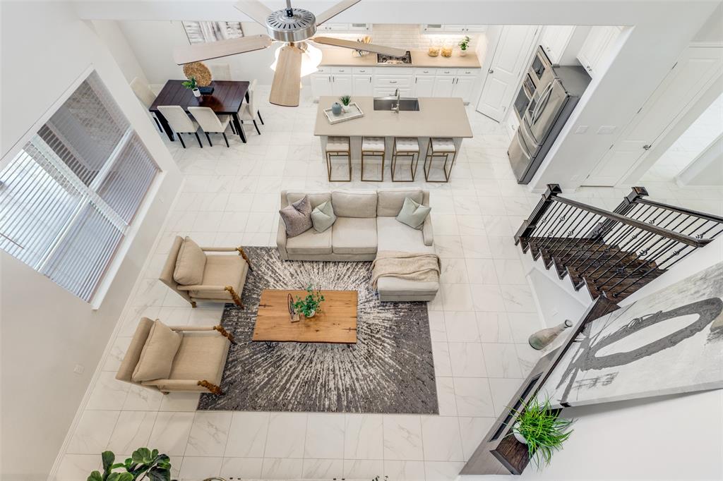2176 Olive Branch Road Frisco, TX 75033 - Photo 17 of 35 a living room with furniture and a wooden floor