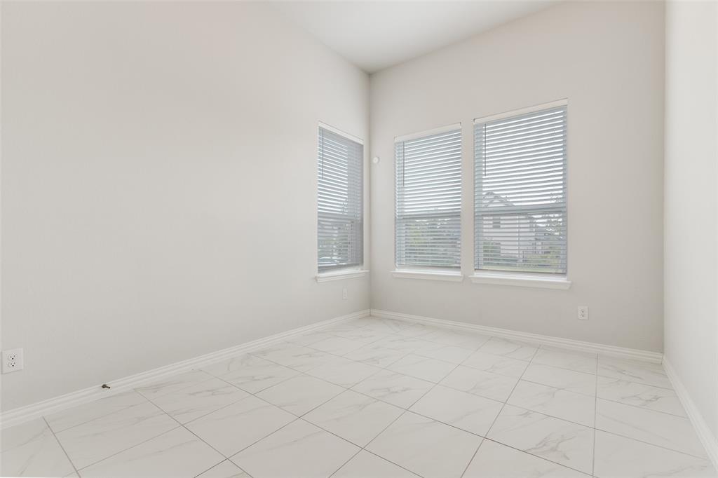 2176 Olive Branch Road Frisco, TX 75033 - Photo 18 of 35 an empty room with windows