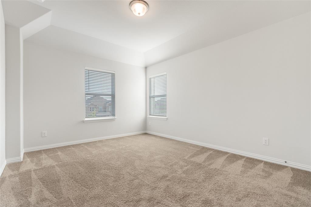2176 Olive Branch Road Frisco, TX 75033 - Photo 23 of 35 an empty room with windows