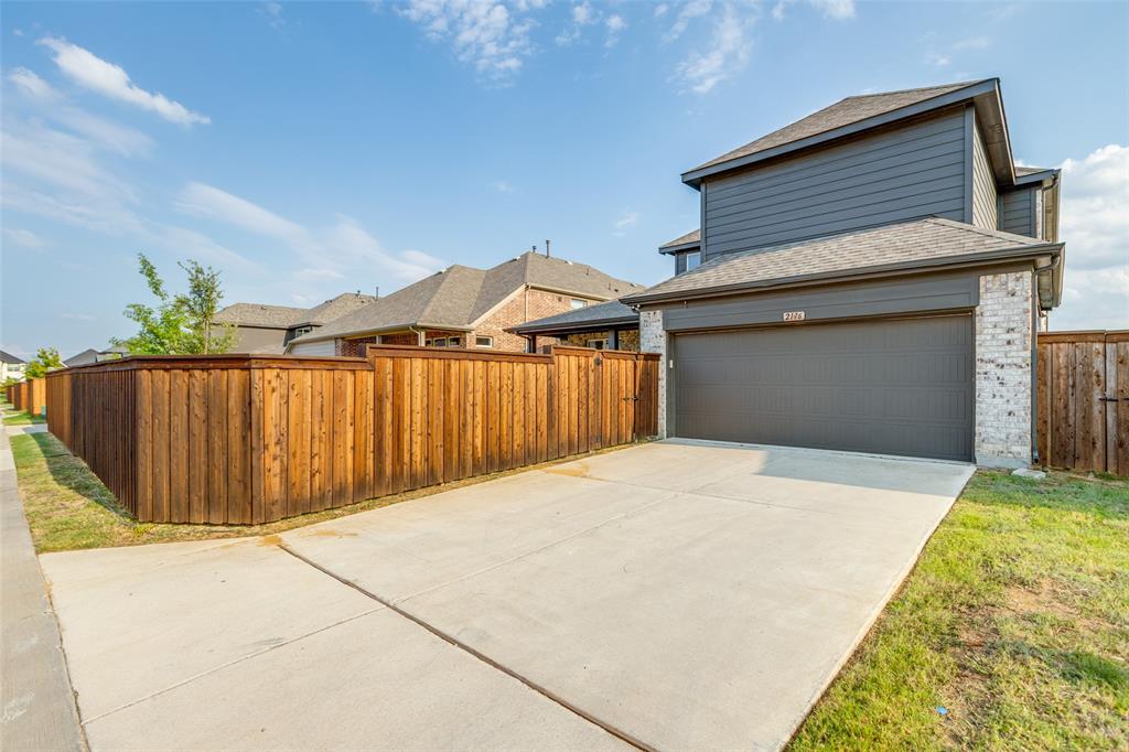 2176 Olive Branch Road Frisco, TX 75033 - Photo 27 of 35 a front view of a house with a garage