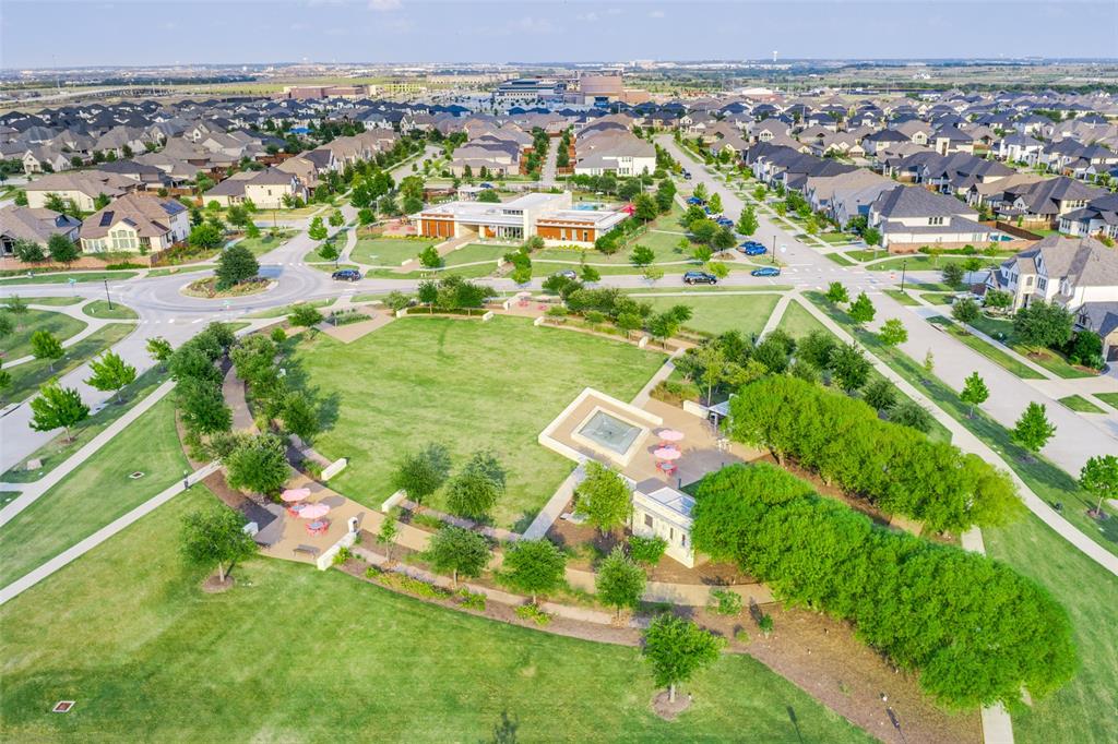 2176 Olive Branch Road Frisco, TX 75033 - Photo 31 of 35 an aerial view of residential houses with outdoor space and trees
