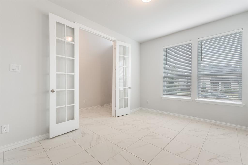 2176 Olive Branch Road Frisco, TX 75033 - Photo 5 of 35 a view of an empty room with a window