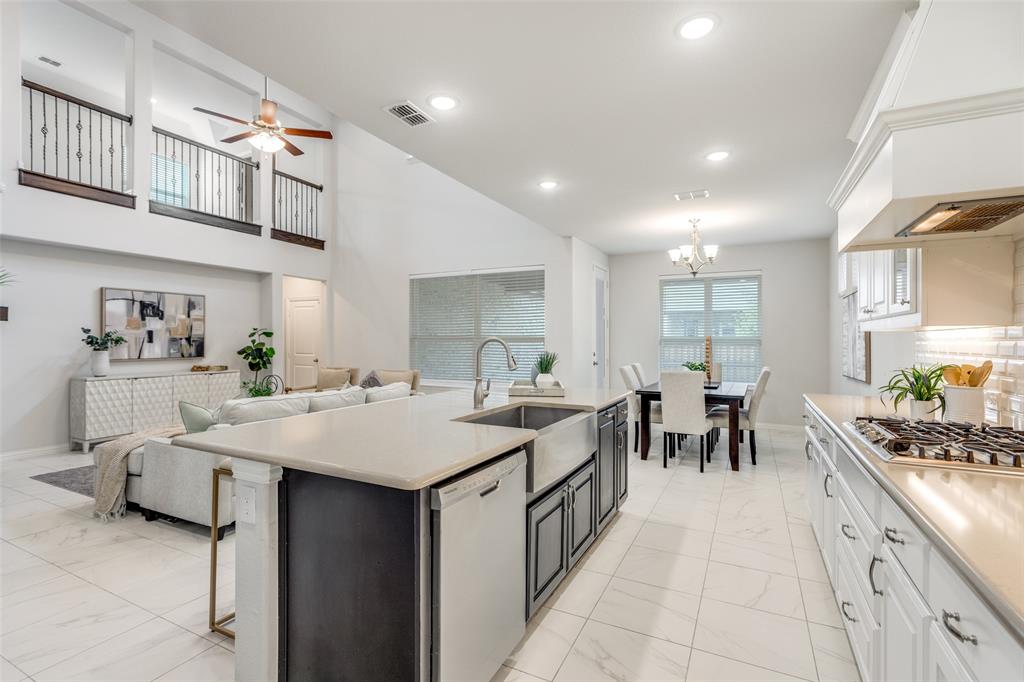 2176 Olive Branch Road Frisco, TX 75033 - Photo 8 of 35 a large white kitchen with lots of counter top space