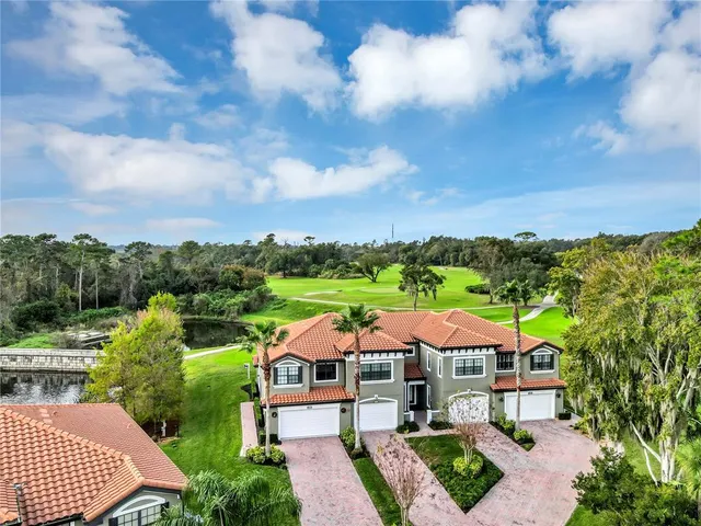 a kitchen with counter top space and living room