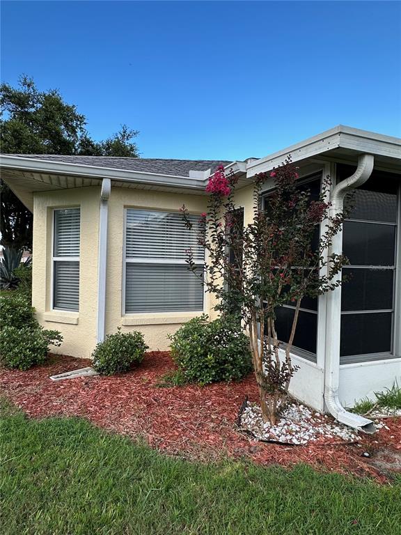 9706 Southwest 92nd Place Road Ocala, FL 34481 - Photo 33 of 82 a view of a wooden house with a yard