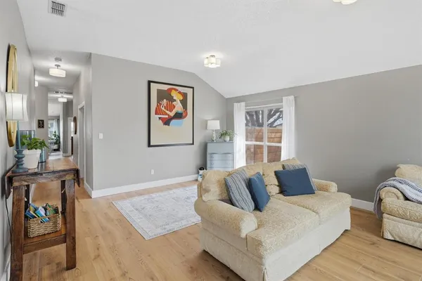 a living room with furniture and a window