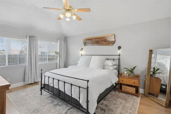 a kitchen with stainless steel appliances kitchen island granite countertop a dining table chairs and sink