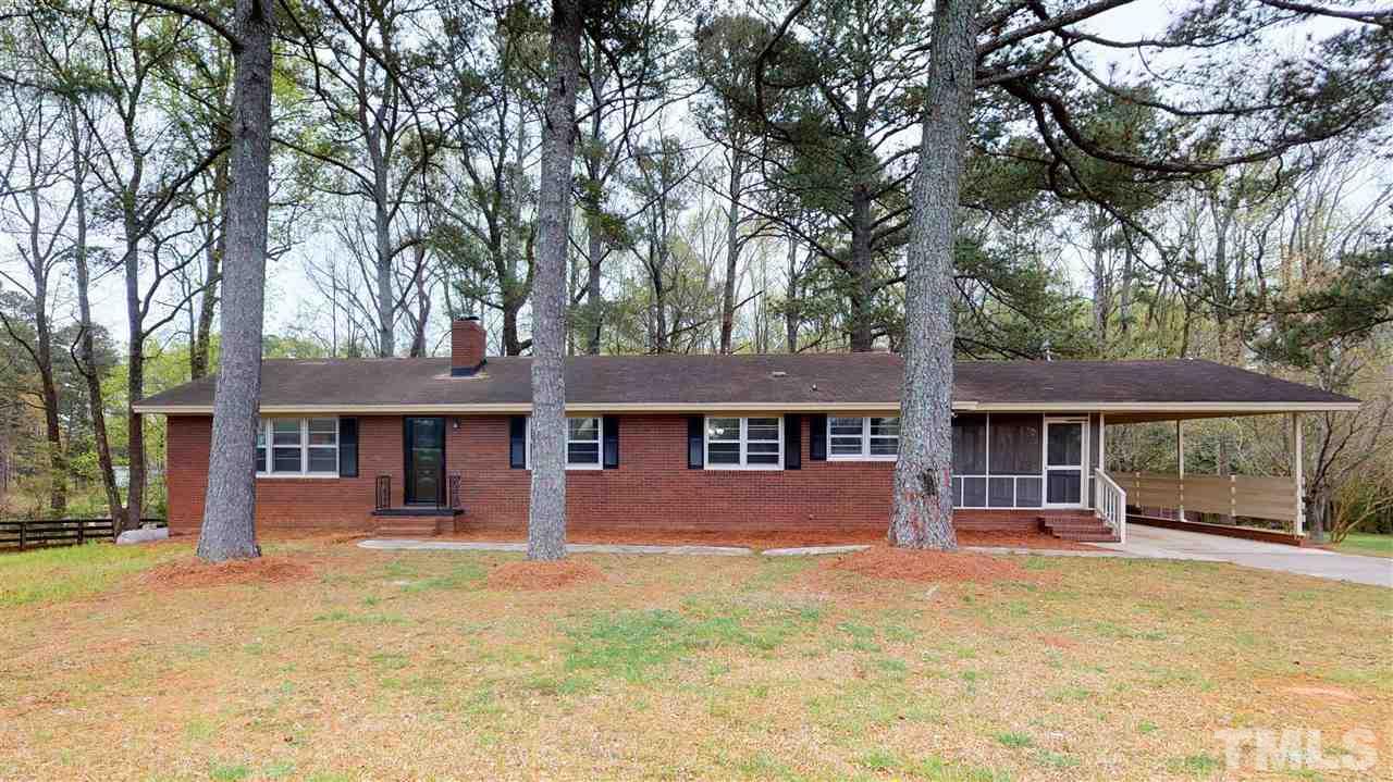 108 Rand Road Raleigh, NC 27603 - Photo 1 of 29 All brick ranch sits on sprawling 3.02 acre lot.