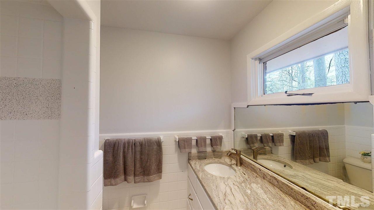 108 Rand Road Raleigh, NC 27603 - Photo 10 of 29 Another photo of Master bath shows that great transom window. Colors in here are so soft.
