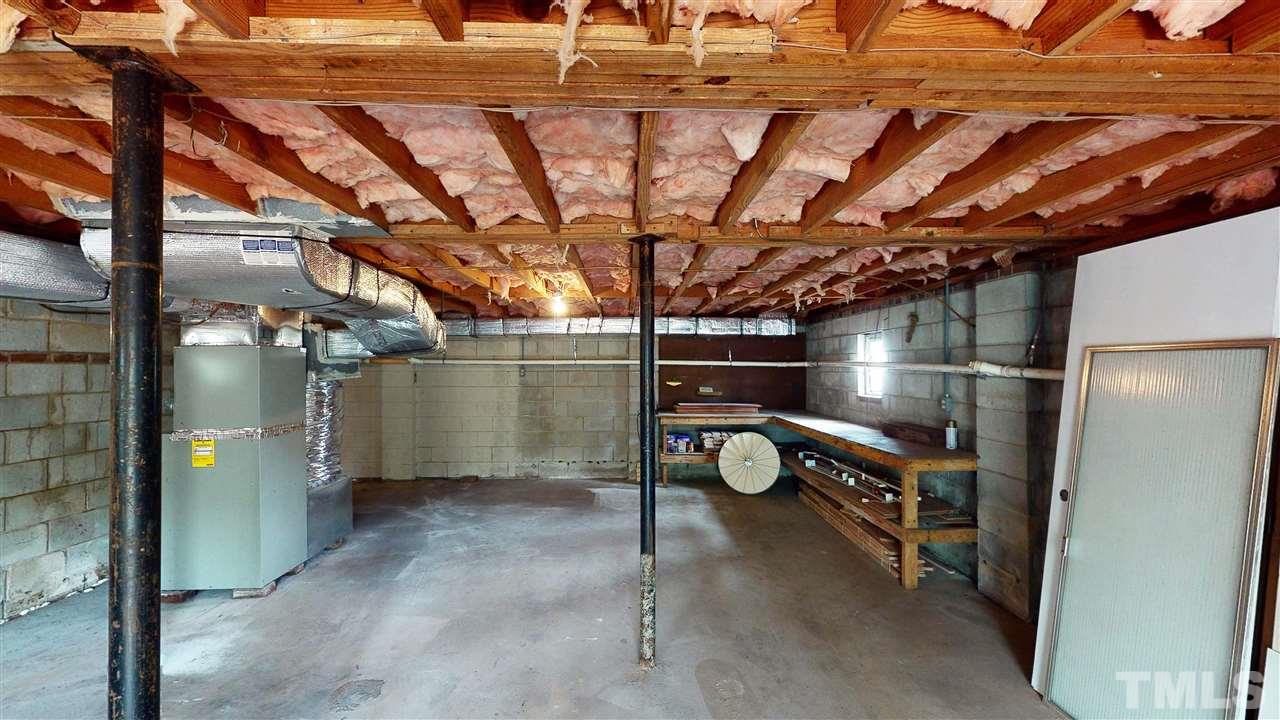 108 Rand Road Raleigh, NC 27603 - Photo 19 of 29 Large basement is plumbed. This photo shows a small section where the workbenches are.
