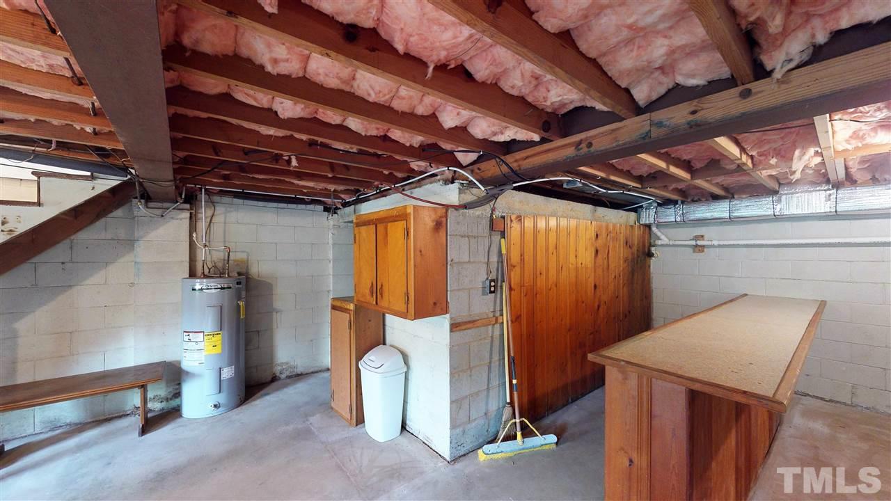 108 Rand Road Raleigh, NC 27603 - Photo 22 of 29 Another view of a small portion of this jumbo basement. The Bar conveys! There is a small room to the left which would make an awesome wine cellar.