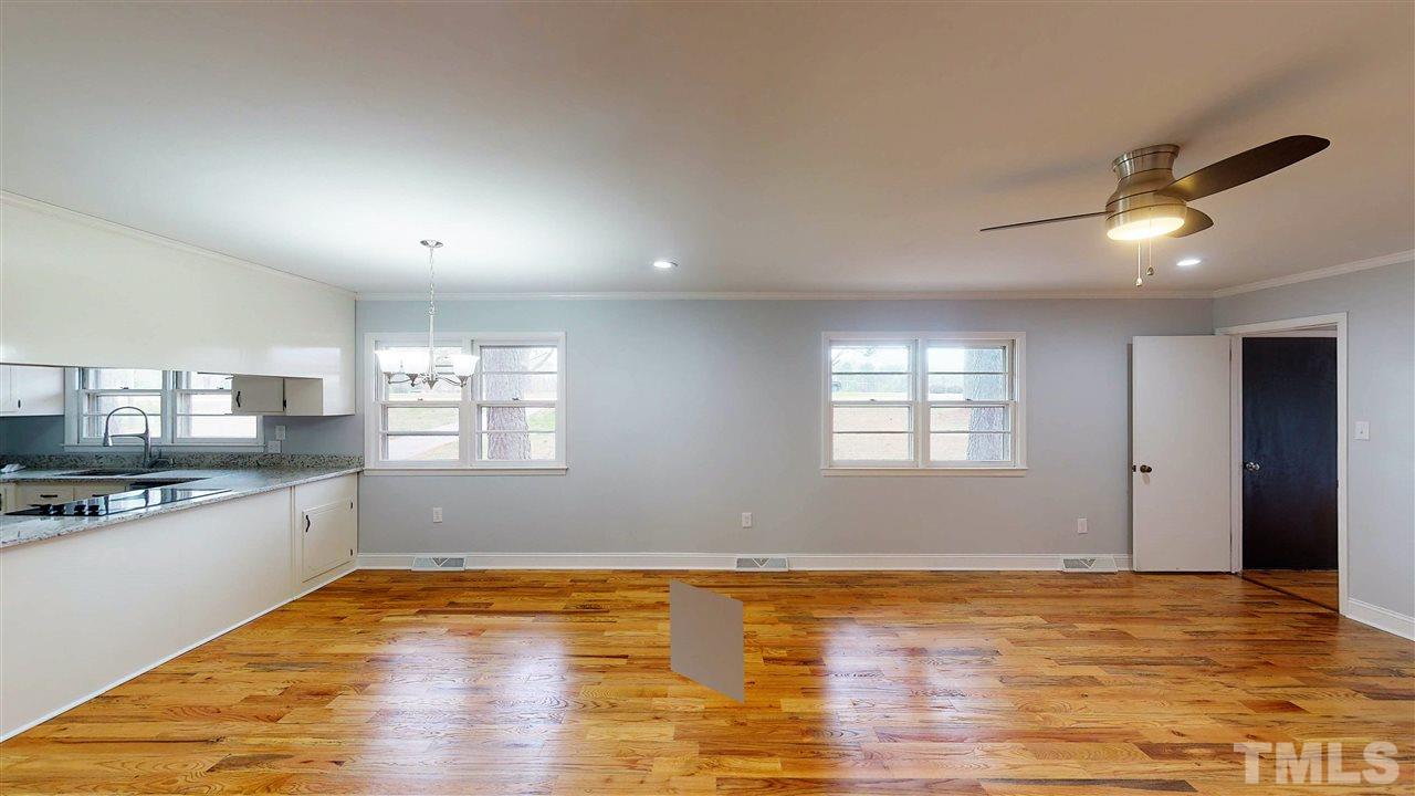 108 Rand Road Raleigh, NC 27603 - Photo 28 of 29 The dining room set up here is perfectly located next to the kitchen for easy serve. If that's not your style, this open floor plan easily allows for creativity.